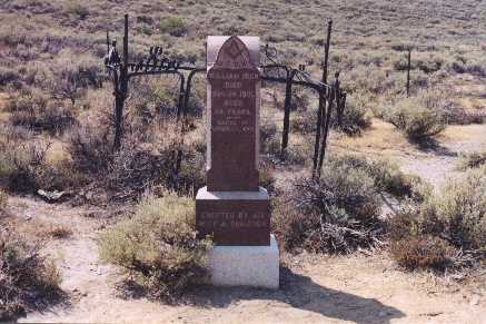 headstone erected by his wife and children